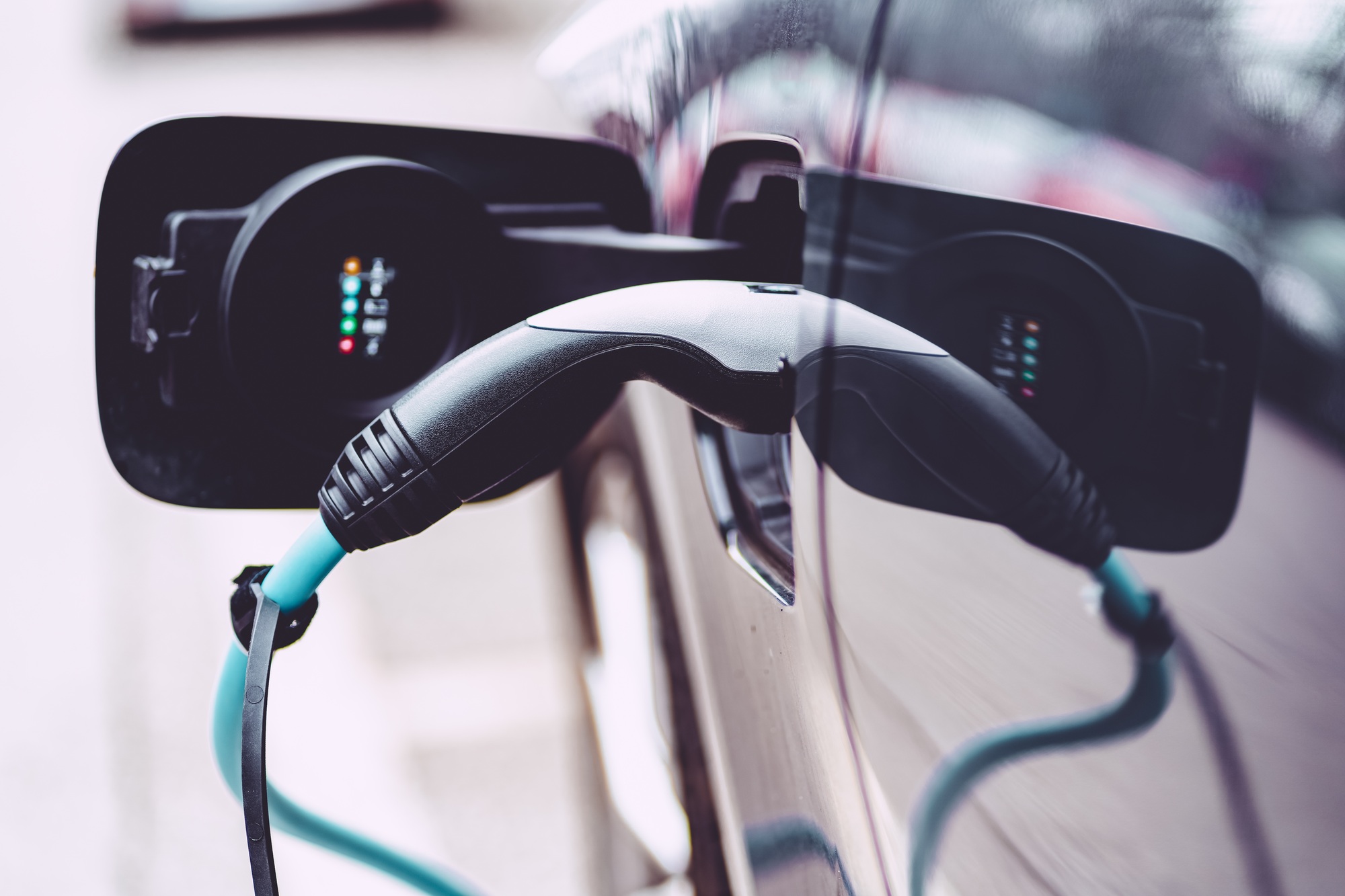 Close-up of a modern electric car which was parked at a charging station for recharging